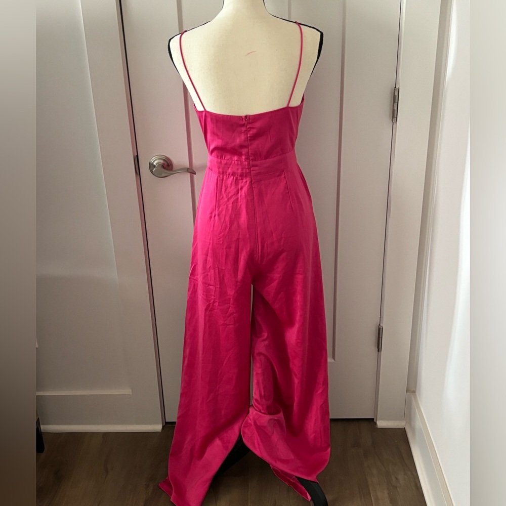 Wide leg hot pink jumpsuit. Spaghetti straps. Size S. Satin feel material.